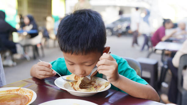 Kid Eating Roti 91 Boy Eating Curry Stock Photos, High-Res Pictures, and Images - Getty ...