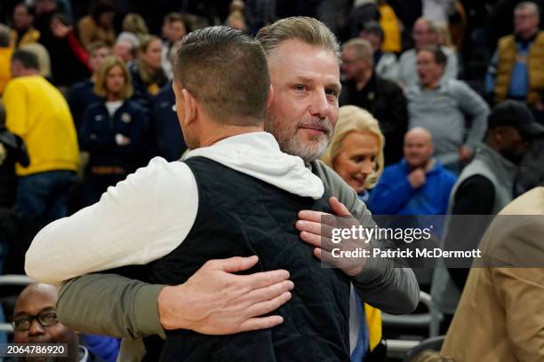 Head coach Matt LaFleur of the Green Bay Packers and head coach Matt Eberflus of the Chicago Bears hug after a game between the Connecticut Huskies...