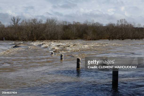 Bridge submerged by the flooded Gard river is pictured in Dions, on March 10, 2024 following heavy rain over south-eastern France.