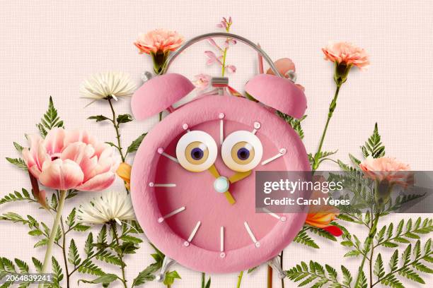 spring forward .spring flowers and alarm clock - daylight saving time stock pictures, royalty-free photos & images