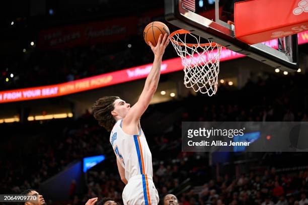 Josh Giddey of the Oklahoma City Thunder scores during the fourth quarter of the game against the Portland Trail Blazers at the Moda Center on March...