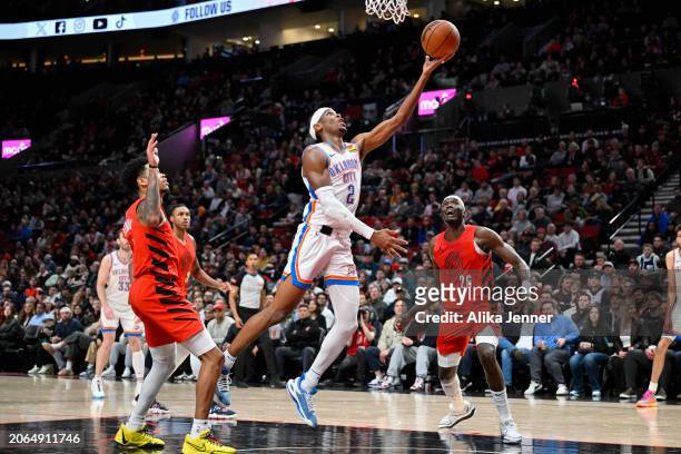 Shai Gilgeous-Alexander of the Oklahoma City Thunder shoots a layup during the third quarter of the game against the Portland Trail Blazers at the...
