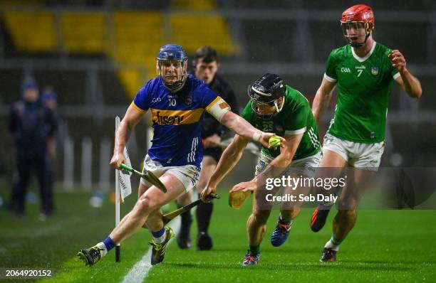 Cork , Ireland - 9 March 2024; Alan Tynan of Tipperary in action against Barry Murphy of Limerick during the Allianz Hurling League Division 1 Group...