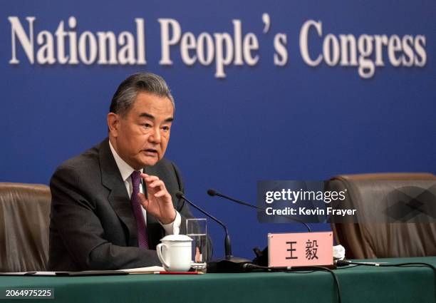 Chinese Foreign Minister Wang Yi speaks during a press conference for domestic and foreign journalists as part of the National People's Congress and...