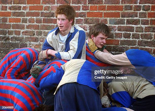 The youngest son of the Prince of Wales, Prince Harry and his brother Prince William take part in the Wall Game between Dr Gailey's Old Boys and the...