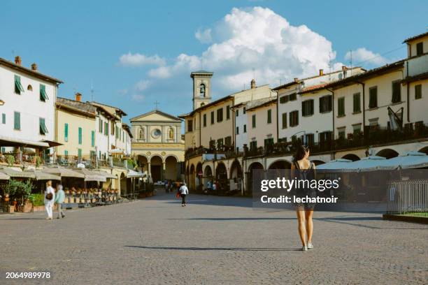 tourist visiting greve in chianti, italy - chianti region stock pictures, royalty-free photos & images