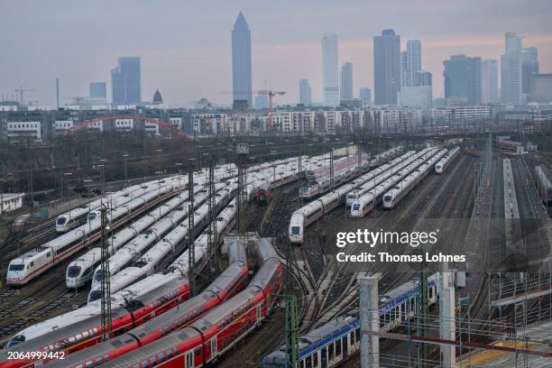 High-speed ICE passenger trains and regional trains of German state railway carrier Deutsche Bahn stand near Frankfurt Hauptbahnhof main railway...