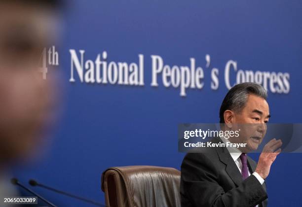 Chinese Foreign Minister Wang Yi speaks during a press conference for domestic and foreign journalists as part of the National People's Congress and...