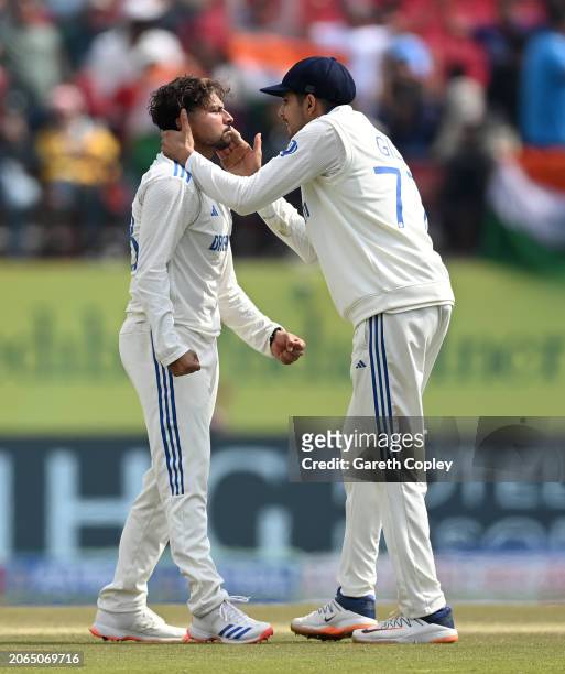 Kuldeep Yadav of India celebrates with Shubman Gill after dismissing Zak Crawley of England during day one of the 5th Test Match between India and...