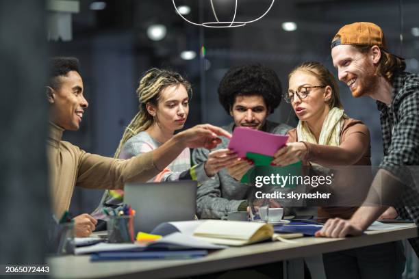 team of young creative people making plans on a meeting in the office. - choosing stock pictures, royalty-free photos & images