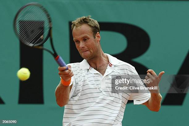 Martin Verkerk of the Netherlands returns in his men's final match against Juan Carlos Ferrero of Spain during the 14th day of the French Open on...