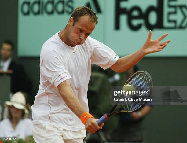 Martin Verkerk of the Netherlands returns in his men's final match against Juan Carlos Ferrero of Spain during the 14th day of the French Open on...