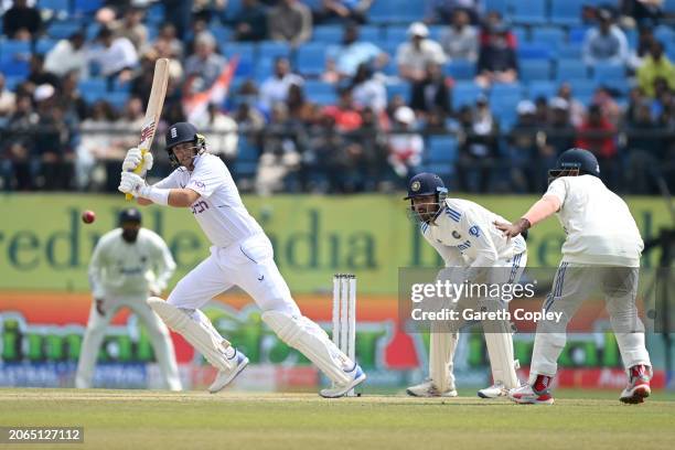 Joe Root of England bats watched by India wicketkeeper Dhruv Jurel during day one of the 5th Test Match between India and England at Himachal Pradesh...