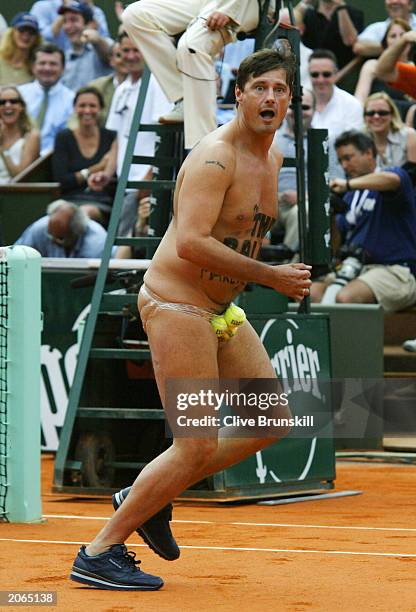 Male streaker runs on court in the men's final match between Juan Carlos Ferrero of Spain and Martin Verkerk of the Netherlands during the 14th day...