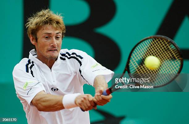 Juan Carlos Ferrero of Spain returns in his mens final match against Martin Verkerk of the Netherlands during the 14th day of the French Open on June...
