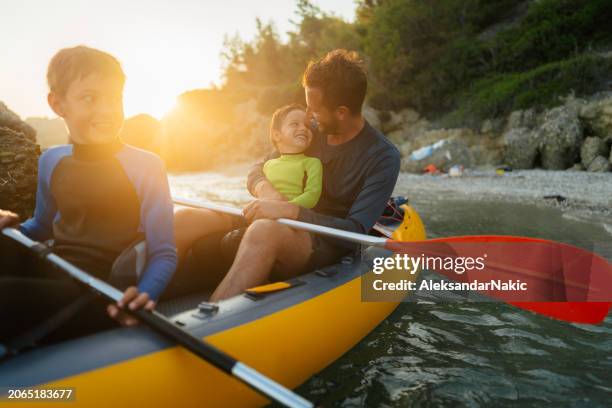 learning the kayaking ropes - kayaking stock pictures, royalty-free photos & images