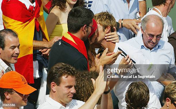 Juan Carlos Ferrero of Spain kisses his girlfriend after winning his mens final match against Martin Verkerk of the Netherlands during the 14th day...
