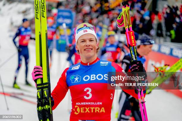 Norway's Johannes Hoesflot Klaebo celebrates winning the Men's Mass Start 50 km Classic race during the FIS Cross Country World Cup in Holmenkollen,...