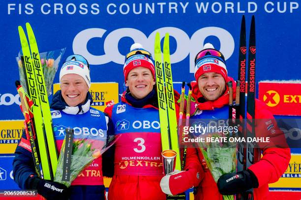 Norway's Johannes Hoesflot Klaebo celebrates winning with second placed Norway's Martin Loewstroem Nyenget and third placed Norway's Paal Golberg...