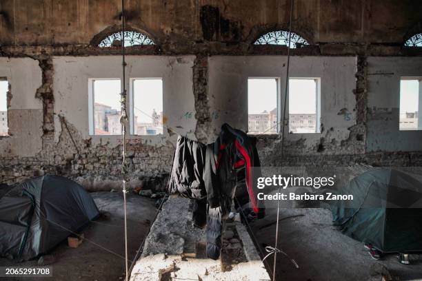 General view inside a silo, a crumbling building lacking sanitation, drinking water and a roof, where migrants sleep inside tents, some made with...