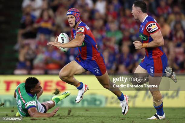 Kalyn Ponga of the Knights makes a break during the round one NRL match between Newcastle Knights and Canberra Raiders at McDonald Jones Stadium on...