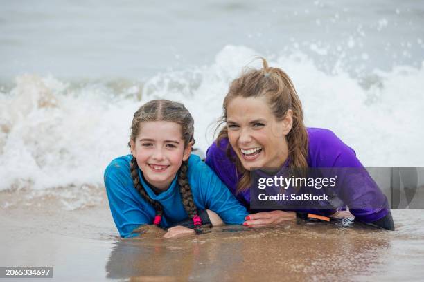 memorable moments at the beach - mom arms crossed stock pictures, royalty-free photos & images