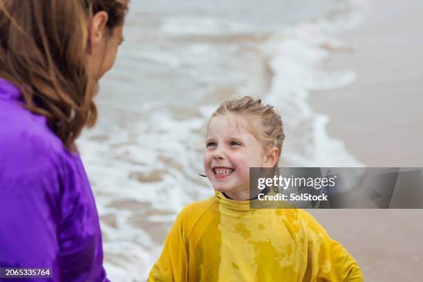 girl smiling at her mother - tooth bonding stock pictures, royalty-free photos & images