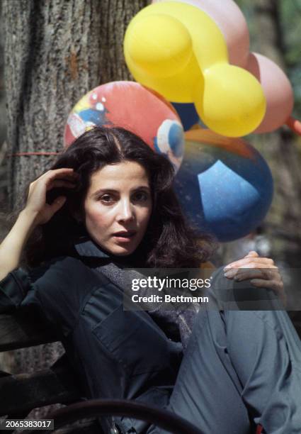Canadian-American actress Barbara Parkins posing with balloons in Central Park, New York, April 20th 1977.