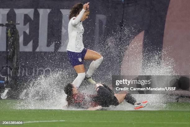 Vanessa Gilles of Canada goes for a tackle on Alex Morgan of the United States during the first half of the 2024 Concacaf W Gold Cup semifinals at...