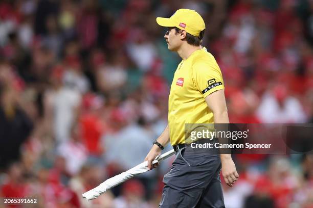 Message is seen on the black arm band worn by a goal umpire during the Opening Round AFL match between Sydney Swans and Melbourne Demons at SCG, on...