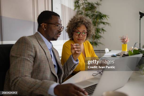 business colleagues working on laptop in the office. - entrepreneur stock pictures, royalty-free photos & images