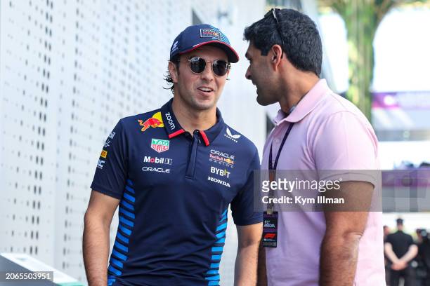 Sergio Perez of Mexico and Oracle Red Bull Racing chats with Karun Chandhok during practice ahead of the F1 Grand Prix of Saudi Arabia at Jeddah...