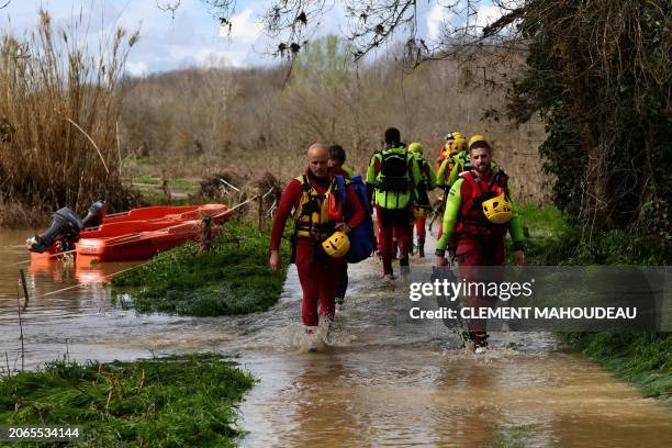 Rescuers take part in searching operations of seven missing persons on the Gardon river in Russan, on March 10, 2024 following heavy rain over...