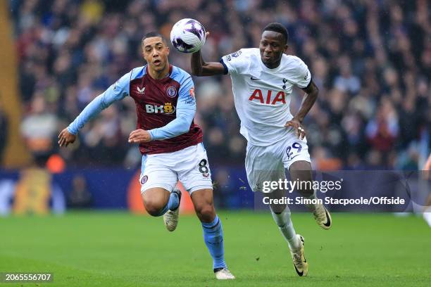 Youri Tielemans of Aston Villa and Pape Matar Sarr of Tottenham Hotspur during the Premier League match between Aston Villa and Tottenham Hotspur at...