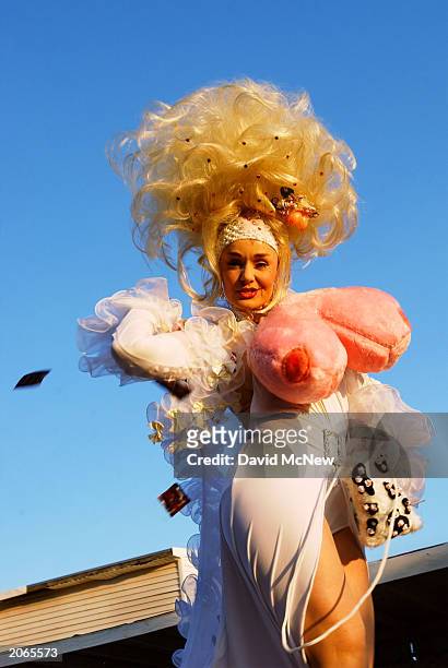 Roobie Breastnut, of Las Vegas, wears large fuzzy toy breasts and tosses condoms to the crowd as she competes in the Miss Exotic World Pageant at the...