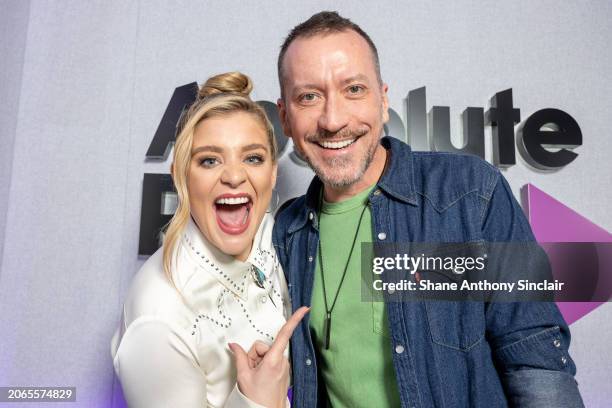 Lauren Alaina and Baylen Leonard poses for a photograph as they visit Absolute Radio at Golden Square on March 07, 2024 in London, England.