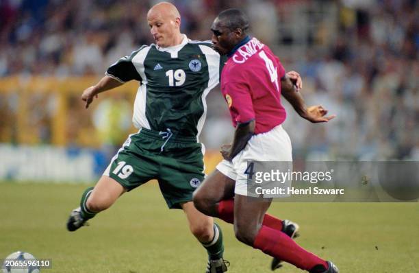 German footballer Carsten Jancker under pressure from British footballer Sol Campbell during the UEFA Euro 2000 Group A match between England and...