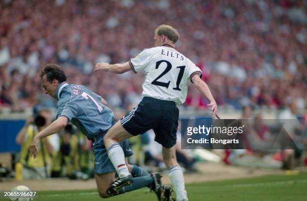 British footballer David Platt under pressure from German footballer Dieter Eilts during the UEFA Euro 1996 semifinal match between England and...