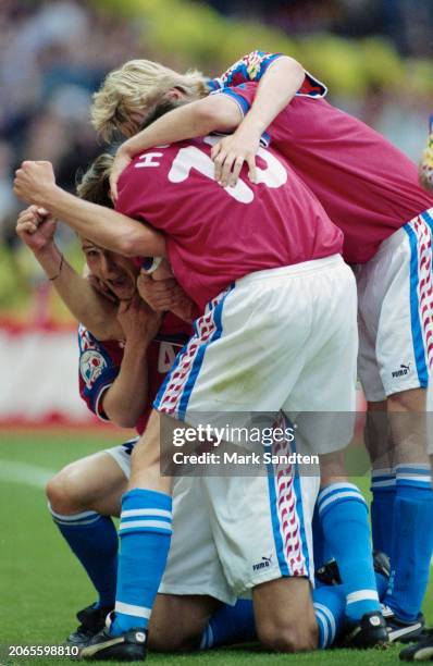 The Czech Republic players, including Pavel Nedved and Michal Hornak, celebrate after Patrik Berger's penalty gives the Czechs the lead in the UEFA...