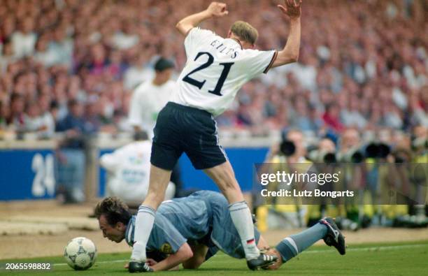 German footballer Dieter Eilts stands over British footballer David Platt during the UEFA Euro 1996 semifinal match between England and Germany, held...