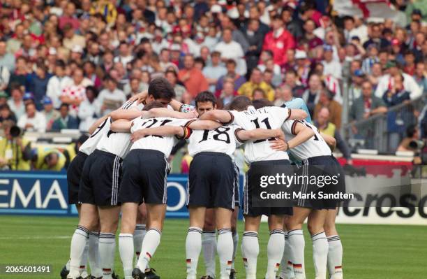 German footballers Dieter Eilts, Jurgen Klinsmann and Stefan Kuntz at the front of the German huddle during the UEFA Euro 1996 final between the...