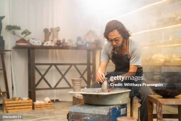 male using their own hands to make a ceramic vase. - east asian works of art specialist stock pictures, royalty-free photos & images