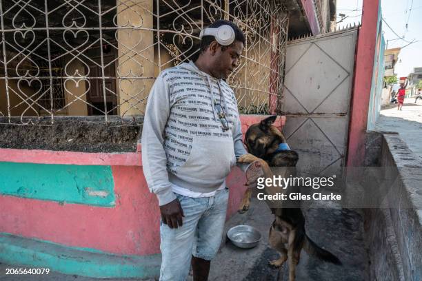 Federation gang leader Jimmy 'Barbecue' Cherizier with his dog, Barbie, in the Delmas 6 neighborhood on February 22 in Port-au-Prince, Haiti. There...