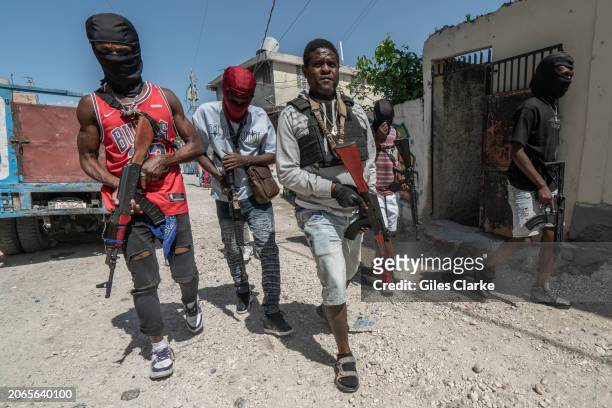 Gang Leader Jimmy 'Barbecue' Cherizier patrolling the streets with G-9 federation gang members in the Delmas 3 area on February 22 in Port-au-Prince,...