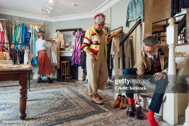 finding his feet - vintage shoes for sale stock pictures, royalty-free photos & images