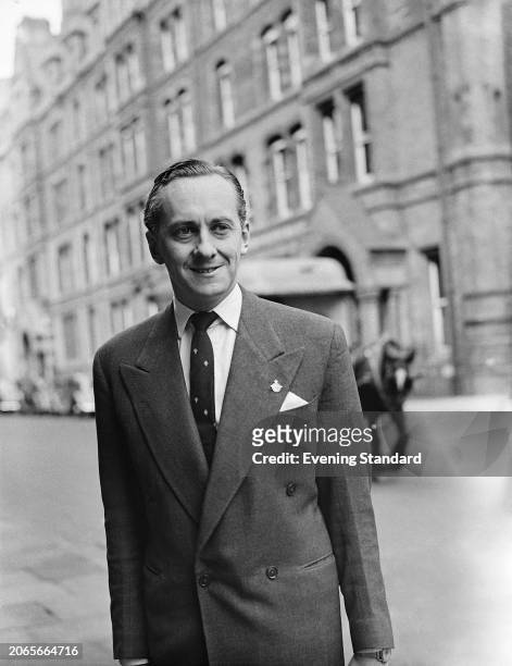 Radio and television presenter Hughie Green attending a civil court case at the Royal Courts of Justice in London, May 7th 1955. Green is suing the...