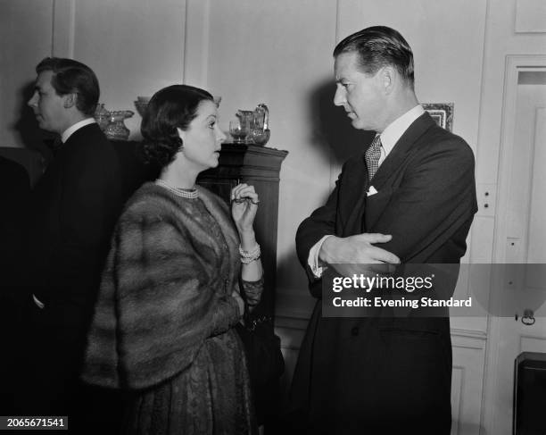 British actress Vivien Leigh in conversation with screenwriter Terence Rattigan , July 23rd 1953.