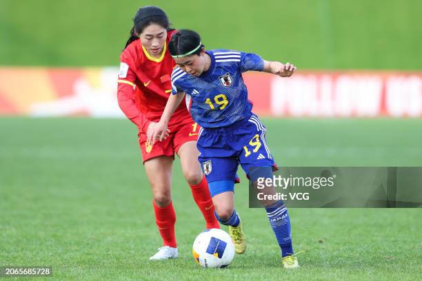 Li Tingyingge of China and M. Matsunaga of Japan compete for the ball during the second round match of the 2024 AFC U20 Women's Asian Cup Finals...