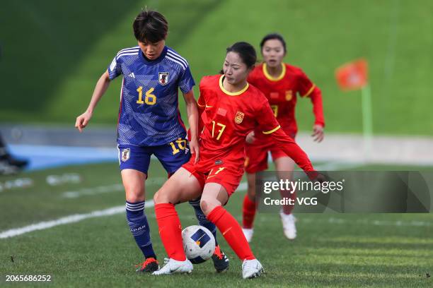 Huo Yuexin of China and S. Amano of Japan compete for the ball during the second round match of the 2024 AFC U20 Women's Asian Cup Finals between...