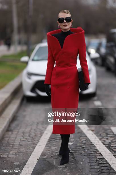 Renata Litvinova is seen wearing Balenciaga Outfit including black heels, black tights, black shades, black hand gloves, rose diamond earrings, a...